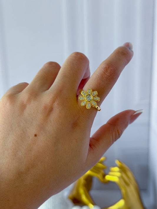 Anillo flor giratoria dorada