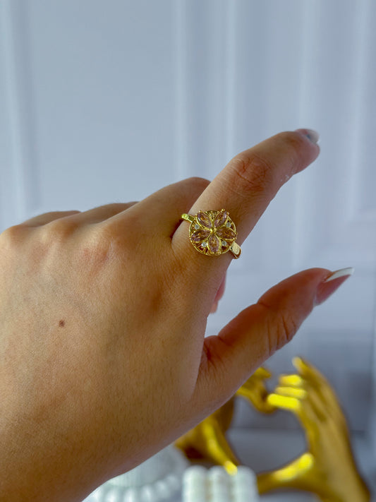 Anillo flor giratoria rosada