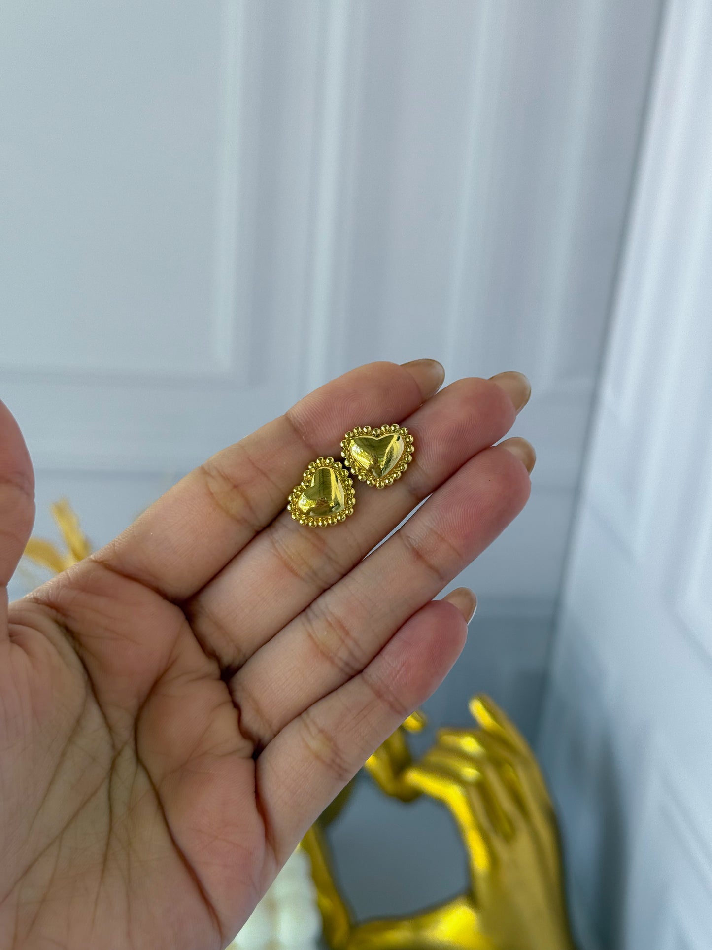 Topo corazón dorado